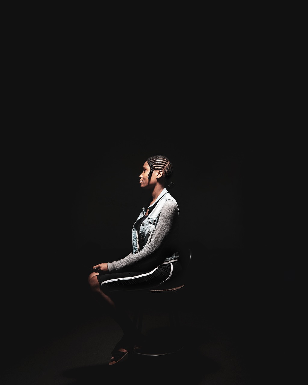Woman, sitting on a chair, portrait, dark